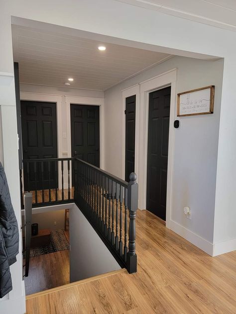 Dark Doors Hallway, Dark Hallway Doors, Dark Doors In Hallway, Black Trim Houses Interior, Gray Walls And Black Doors, Black Doors With Grey Walls, Black Doors Upstairs, Black Doors Grey Walls, Black Doors In House