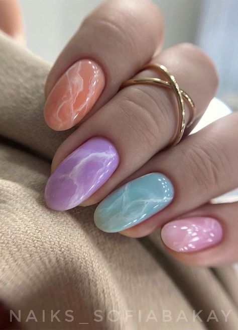 33. Pastel Marble nails A beautiful mixed pastel nail set. As spring is on the way, so if you’re looking for spring nails then... Marble Nails Pastel, Marble Spring Nails, Marble Pastel Nails, Pastel Marble Nail Art, Eye Catching Nails, Cute Nails Pastel, Matte Pastel Nails, Spring Marble Nails, Trendy Pastel Nails