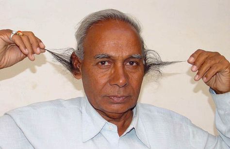 Credit: Prakash Hatvalne/AP 2002: BD Tyagi of Bhopal, India, demonstrating that growing the world's longest ear hair is a serious matter, an... The Shed, Ear Hair, Weird World, Bad Hair Day, Laser Hair Removal, Crazy Shoes, Guinness, Hair Day, Hair Removal