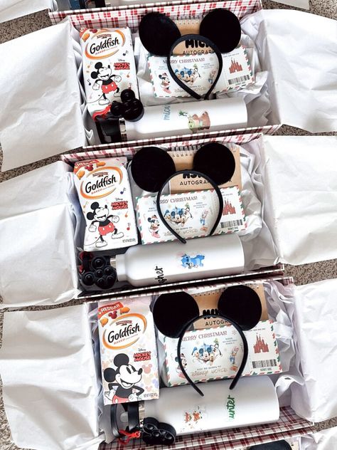 Surprising Our Kids: We’re Going To Disney World! – At Home With Natalie Disney World Gift Basket, Disney Surprise Boxes, First Disney Trip Gift Basket, Your Going To Disney Surprise, Disney Boxes Surprise, Disney For Christmas Gift, Disney Trip Gift Reveal, Disney Vacation Basket Ideas, Things For Disney Trip