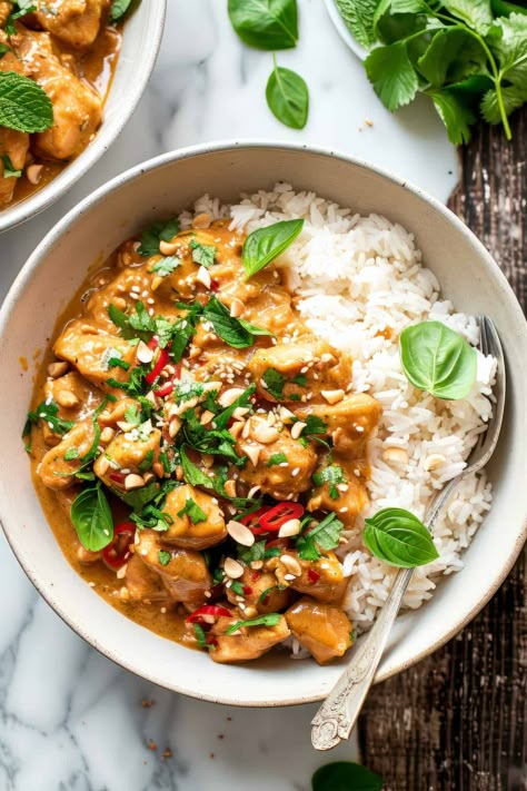 A quick and easy 30-minute chicken recipe, this peanut butter chicken with coconut sauce is a great budget-friendly dinner recipe. Creamy peanut coconut sauce with a little bit of spice, all tossed with bell peppers and crispy tender chicken. Serve over rice or noodles. Similar to a peanut satay sauce this recipe freezes well making it perfect for meal prep, too. Peanut Satay Chicken Noodles, Chicken Satay Dinner, Spicy Thai Peanut Chicken, Healthy Satay Chicken, Peanut Sauce Meals, Mild Butter Chicken Recipe, Spicy Peanut Butter Chicken, Peanut Satay Noodles, Chicken With Peanut Butter Sauce