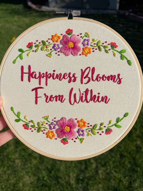 A 7" hand sewn embroidery hoop. Has a floral design with the quote "Happiness Blooms From Within". The back is closed off felt. Hand Embroidery Quotes, Flower Embroidery Hoop, Embroidery Quotes, Quotes Embroidery, Quote Embroidery, Quote Happiness, Embroidery Hoop Art Diy, Flower Background Images, Embroidery Stitches Beginner