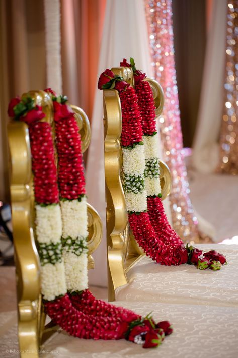 Aon Ballroom Wedding - Hindu celebration - Rebecca Marie Photography  Esha & Kapil's wedding at Aon Ballroom and Navy Pier in Chicago featured gorgeous traditional details, friends and family coming together, and a color palette of blush, bright pink, turquoise, magenta, and ruby. Hindu Wedding Mala, Pink Stage Decorations, Flower Garlands For Wedding, Marriage Malai Design, Hindu Wedding Garland, Wedding Malai Design, Marriage Garlands, Varmala Indian Weddings, Garland Wedding Indian