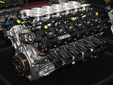 In 1989, Yamaha Motor began its challenge in Formula 1, the pinnacle of automobile racing, as an engine supplier. Exclusively developed V8, V10 and V12 engines were supplied to the renowned Brabham, Jordan, Tyrrell and Arrows F1 teams. The OX99 5-valve V12 F1 engine pictured here was supplied to the Brabham and Jordan teams. In 1992, Yamaha developed the "OX99-11" production supercar that mounted this GP engine. In all, Yamaha's F1 challenge lasted for nine years. During that time, Yamaha engin Yamaha Engines, Automobile Engineering, V12 Engine, Classic Racing Cars, Yamaha Motor, Motor Engine, Performance Engines, Race Engines, Combustion Engine