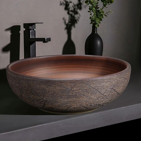 This round sink will add style to any bathroom. Thanks to its special finish, this sink is modern and stylish. You can use this creative ceramic sink as a practical vessel and decorative piece in your home. It can be used in various settings and is also super simple to clean. The ceramic structure is of the highest quality, refined, and robust, and the pattern on the basin is handmade. It adds a touch of elegance to your bathroom with its streamlined shape and efficiency. Beauty of artistic  Dur Bathroom With Copper Sink, Wooden Vanity Unit Bathroom, Ceramic Vessel Sink, Vessel Sink Powder Room, Bathroom Sinks Bowl, Bowl Sink Bathroom, Unique Bathroom Sinks, Stucco House, Bathroom Sink Bowls