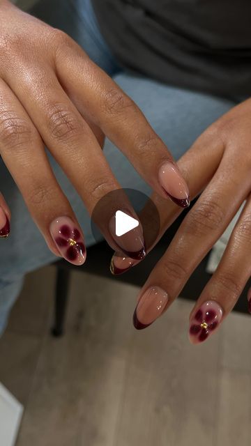 IT’S A LIFESTYLE NAILS | SAN JOSE on Instagram: "These blooming gel flowers are my new obsession🌺
The original Inspo was all French but we added some chrome gold details and another flower on the thumbs✨
Using @daily_charme gold chrome as always code: Elena10
@kokoistusa honey tea base 
@vbeautypure 003 burgundy gel 
.
.
.
.
.
.
#sanjosenails #bayareanails #almondnails #natutalnails 
#chromenails #nailinapo #fallnails" French Blooming Gel, Burgundy Blooming Gel Nails, Blooming French Tip Nails, Blooming Gel Nails Fall, Burgundy Flower Nails, French Flowers Nails, Brown Blooming Gel Nails, Blooming Gel Flower Nails, Blooming Gel French Tip