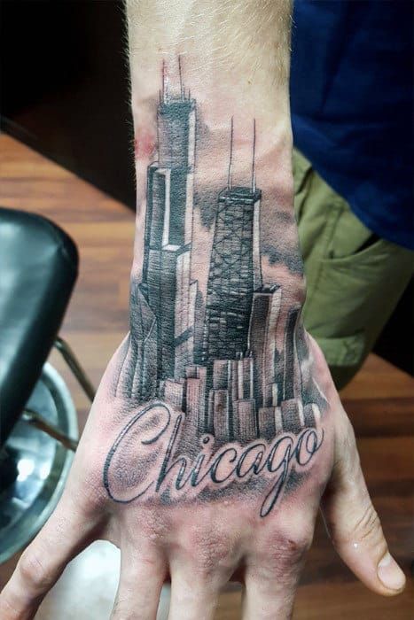 Hand Tattoo Of Chicago Word With City Skyline Buildings In Background On Man Chicago Sleeve Tattoo, City Tattoo Ideas For Men, Chicago Tattoo Ideas Men, Chicago Tattoo Ideas, City Tattoo Ideas, Chicago Flag Tattoo, Chicago Skyline Tattoo, Jake Tattoo, Tattoos Life