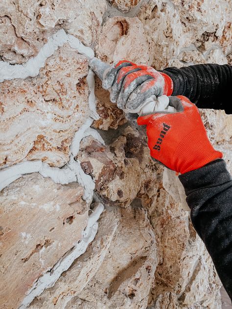 How we Modernized our 1970's Rock Wall - Nesting With Grace Rock Wall Ideas Interior, Exterior River Rock On House, River Rock Entryway, Painting Rock Wall Fireplace, Update Rock Exterior, Updating Old Stone Fireplace, Painted Rock Walls Exterior, Lava Rock House Exterior, 1970s Stone House Exterior