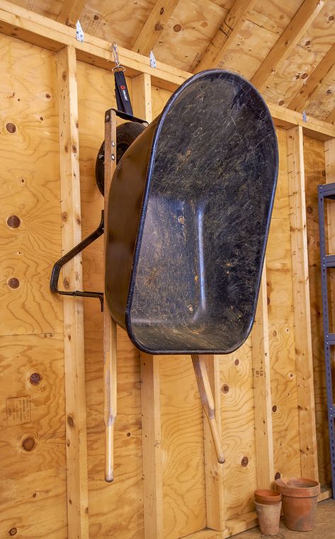 Looking for garage organization ideas? Try this easy garage storage tip - hang up large, bulky and heavy items with VELCRO® Brand Easy Hang™ Straps to clear space on the ground. They're even strong enough to hold a wheelbarrow! Keep following us for more home organization ideas. #garage #garageorganization #homeorganization #garageideas #storage #storageideas #organization #organizing #VELCROBrand #VELCRO Wheelbarrow Storage, Easy Garage Storage, Garage Projects, Garage Organization Ideas, Garage Storage Ideas, Overhead Garage Storage, Overhead Garage, Shed Organization, Small Garage