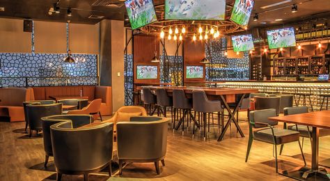 The 10 BEST Sports Bar Design Ideas: How To Design A Sports Bar (2024) Restaurant Lighting Design, Sport Bar Design, Bar Design Ideas, Sports Bars, Brunch Places, Casual Dining Restaurant, London Bars, Restaurant Concept, Bar Interior