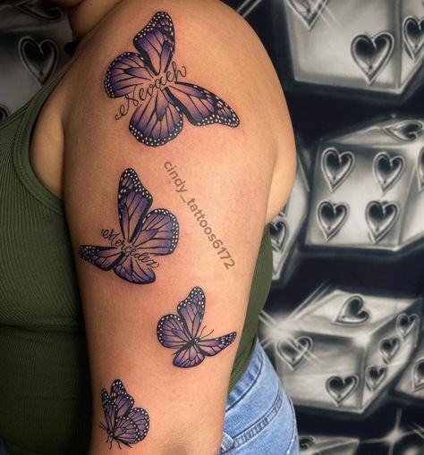 Purple Butterflies Tattoo, Butterfly Tattoo With White Highlights, Name In Butterfly Tattoo, Butterfly With Names Tattoo, Butterfly Tattoo Name, Butterfly Name Tattoos For Women, Butterfly Tattoo With Name In The Middle, Butterfly With Name Tattoo, Slow Tattoo