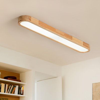 This wooden oval dimmable led flush mount seamlessly blends nordic and modern design elements, making it an ideal addition to various spaces such as bedrooms, living rooms, corridors, cafes, and offices. Crafted from solid wood and acrylic, the oval wood ceiling light boasts a lamp body made of rubber wood with distinct texture. Built-in LED light source eliminates the hassle of frequent bulb replacements. With evenly distributed LEDs, it offers over 80% high light output, while the remote contr Flush Mount Ceiling Lights Office, Small Galley Kitchen Lighting, Long Flush Mount Kitchen Light, Walk In Closet Ceiling Light, Long Ceiling Light, Kitchen Flush Mount Lighting Ideas, Strip Lighting Ceiling, Playroom Lighting, Home Office Lighting Ideas