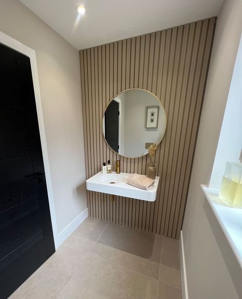 Embrace style in your small downstairs bathroom with our waterproof Slat Wall panelling! Say goodbye to water damage and re-grouting and hello to a stunning, hassle-free space💧✨ Downstairs Toilet Wood Panelling, Small Downstairs Toilet Panelling, Wooden Slat Wall Interiors Bathroom, Wall Cladding Bathroom, Cloakroom Wood Panelling, Wood Panel Toilet Wall, Slat Wood Bathroom, Wooden Panneling Design Wall Bathroom, Bathroom Slat Wall Ideas