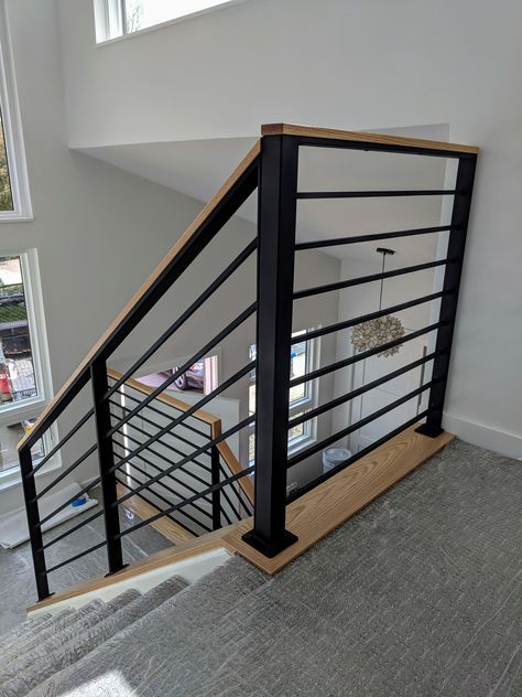 Example of custom steel rail with red oak cap to match flooring and cabinetry.  #customrails #railings #custommetalfabrication #steelrails #interiorrails #woodcap #thedesignisinthedetails #hcg #heronconstructiongroup Metal Stair Railing With Wood Handrail, Railing Cap Ideas, Metal Railing With Wood Handrail, Ballustrade Metal And Wood, Steel Handrails For Stairs, Metal Railings Indoor, Stair Railing Interior, Wood Stair Railing, Wood Railings For Stairs