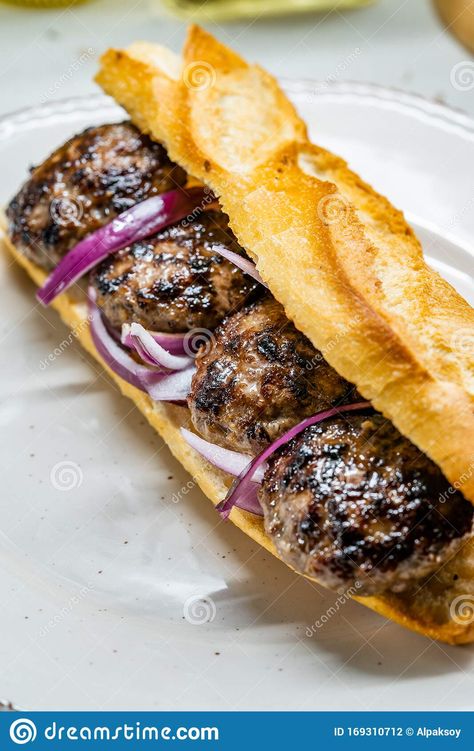 Photo about Turkish Kofte Ekmek / Meatball Sandwich with Red Onions. Traditional Fast Food from Turkey. Ready to Eat. Image of dinner, takeaway, snack - 169310712 Turkish Sandwich, Turkish Kofte, Turkish Food Traditional, Turkish Meatballs, Growing Up British, Meatball Sandwich, Turkey Stock, Mystic Moon, Pink Perfume