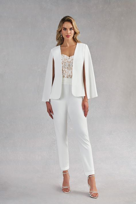 Surprise your guests with how modern you are by wearing our three-piece bridal pant suit, Tiffany. This style is made from stretch crepe, lace, and stretch satin. Her jacket is stylized with a cape instead of sleeves, the pants are high-waisted while the sweetheart bustier is drop-waisted to give a contoured look. The ankle length pants are a play on the tuxedo pant with a cummerbund waistband. White Wedding Suit For Women, Bridal Pant, Lesbian Wedding Suit, Modern Elegant Wedding Dress, Lesbian Wedding Outfits, Bridal Pant Suit, Jumpsuit Modern, Wedding Dress Jumpsuit, Bridal Pantsuit