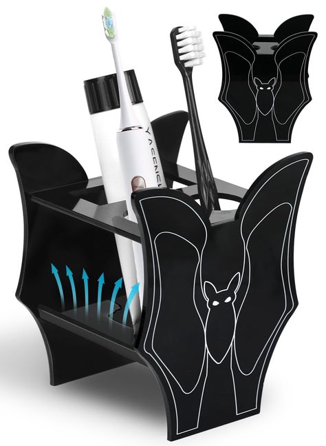 PRICES MAY VARY. SPOOKY GOTHIC BATHROOM DECOR: The goth decor bathroom toothbrush holder has a stylish bat design with simple and smooth lines. It is the epitome of Gothic aesthetics and will inject a weird Gothic and spooky atmosphere into your room DECORATIVE FORM MEETS FUNCTION: The Halloween vampire home decor tooth brushing holder retains the weird Gothic appearance while setting two 1.4'' diameter round holes and a 1.2'' * 3.1'' square hole. You can store toiletries according to your needs Apartment Decorating Spooky, Silly Home Decor, Emo House Decor, Romantic Goth Decor, Goth Apartment Decor, Goth Office Decor, Apartment Halloween Decorations, Halloween Apartment Decor, Goth Bathroom Decor