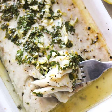 The Best Baked Corvina Recipe | Baked corvina is an elegant seafood dish that's easy to make in only 20 minutes. The tender and flaky fish is coated with a delicious garlic, lemon, and herb melted butter, then briefly roasted for a restaurant-quality meal right at home. - The Top Meal Corvina Recipes, Corvina Fish Recipes, Sea Bass Recipes, Fish Marinade, Scallop Dishes, White Fish Recipes, Baked Fish Recipes, Herb Sauce, Fish Recipes Healthy