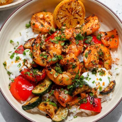 30 Minute Greek Shrimp Bowls - Dishing Out Health Healthy Grain Bowls, Shrimp Bowls, Dishing Out Health, Greek Shrimp, Shrimp Bowl, Mediterranean Recipes Healthy, Mediterranean Diet Recipes Dinners, Shrimp And Vegetables, Grain Bowls