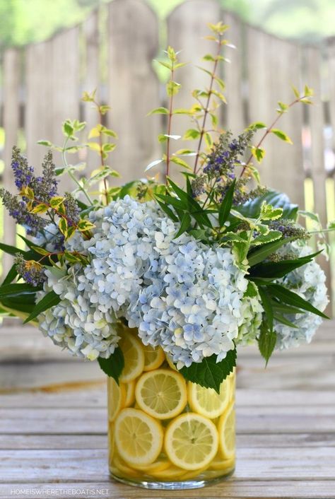 We love this easy DIY Lemon Vase Flower Arrangement. Do it yourself low cost simple elegant best DIY wedding centerpiece idea for 2021. Save this to Pinterest and make for your next Summer party or wedding. Lemon Flower Arrangements, Lemon Vase, Lemon Themed Party, Summer Wedding Centerpieces, Lemon Centerpieces, Lemon Themed Bridal Shower, Lemon Flower, Lemon Flowers, Summer Table