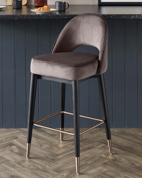 The Clover Mocha Velvet Bar Stool is the perfect addition to your kitchen island or home bar. Upholstered in a sleek mocha brown velvet, the bar stool has brushed bronze capped legs to add an element of luxury. The curved back with the cut out is a nod to mid-century style chairs giving this modern bar stool a timeless look. Mid Century Bar Stools, Bar Chairs Kitchen, Luxury Bar Stools, Fabric Bar Stool, Brown Bar Stools, Island Chairs, Bar Stools Kitchen Island, Velvet Stool, Tiki Bar Decor