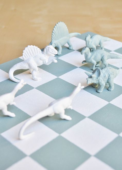 DIY Chess Set #nationalchessday Diy Chess Set, Checkered Board, Diy Dinosaur, Chess Gifts, Chess Set Unique, Dinosaur Gifts, Dinosaur Decor, Diy Games, Chess Set