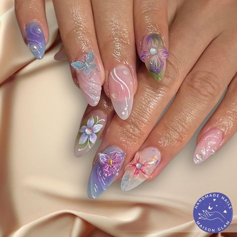 3D Floral & Butterfly Press-On Nails in Pastel Shades 🌸🦋 Bring your nails to life with this enchanting set of handcrafted press-on nails, featuring dreamy 3D florals, delicate butterflies, and soft pastel tones. This gorgeous set blends shades of lilac, pink, and blue with intricate 3D flowers and butterflies for a magical, garden-inspired look. 🌸 3D Floral Magic: With flowers and butterflies, stones and pearls these nails are 3D.  🎨 Pastel Perfection: Soft purple, pink, and blue hues create a whimsical, romantic feel. 💅 Almond Shape: The sleek almond shape gives your nails a graceful, elongated appearance. ✨ Set Includes: 10 nails + an easy application kit, ensuring a flawless, salon-quality finish at home. 🔄 Reusable & Long-Lasting: These beautiful nails are designed for repeat wea Flower Garden Nails, Gel Nails Pastel, Cristal Nails, Acrylic Gel Nails, Garden Nails, Nails Pastel, 3d Flower Nails, Airbrush Nails, Green Nail Designs