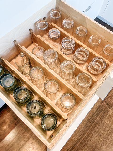 Glasses lined up in rows in a drawer divided by expandable bamboo drawer dividers Glasses In Kitchen Drawers, Drawer Storage For Glassware, Glassware Drawer Storage, Drawer Glass Storage, Storing Wine Glasses In Drawers, Bamboo Drawer Dividers, Cutlery Organizer Ideas, Cups In Drawers, Glassware Drawer