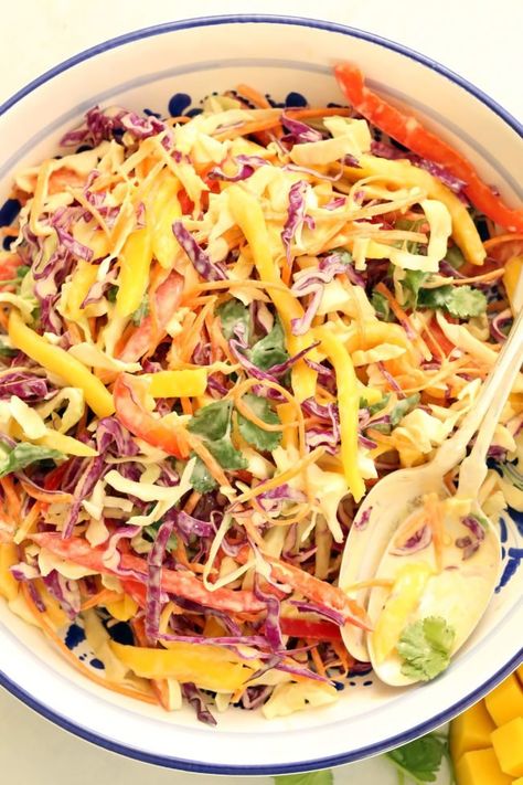 This creamy Mango Slaw (healthy coleslaw) is light, fresh, creamy, crunchy and so easy to make!!   It's a delicious homemade coleslaw made with green cabbage, red cabbage, red pepper, carrots, cilantro and mango all tossed in a creamy citrus coleslaw dressing. Mango Slaw Recipes, Creamy Coleslaw Dressing, Healthy Coleslaw Recipes, Cabbage Benefits, Healthy Coleslaw, Mango Slaw, Slaw Dressing, Harvest Kitchen, Citrus Dressing