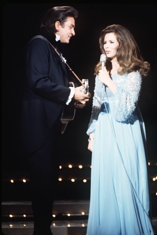 JOHNNY CASH AND JUNE CARTER RETURNED TO THE GRAND OLE OPRY STAGE WHERE THEY MET TO PERFORM TOGETHER IN 1970L ABC PHOTO ARCHIVESGETTY IMAGES Johnny Cash And June Carter, June And Johnny Cash, Johnny Cash And June, John Cash, Jonny Cash, Johnny Cash June Carter, June Carter, June Carter Cash, Johnny And June