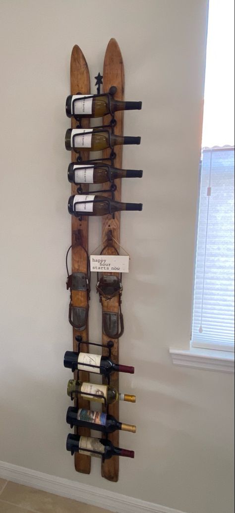 Old wooden skis turned into a wine rack. Old Ski Decor Ideas, Ski Wine Rack, Ski Display Ideas, Old Snow Skis Ideas, Ski Themed Living Room, Ski Themed Bathroom, Skis On The Wall, Ski Chalet Decor Lodge Style, Repurpose Old Skis Ideas