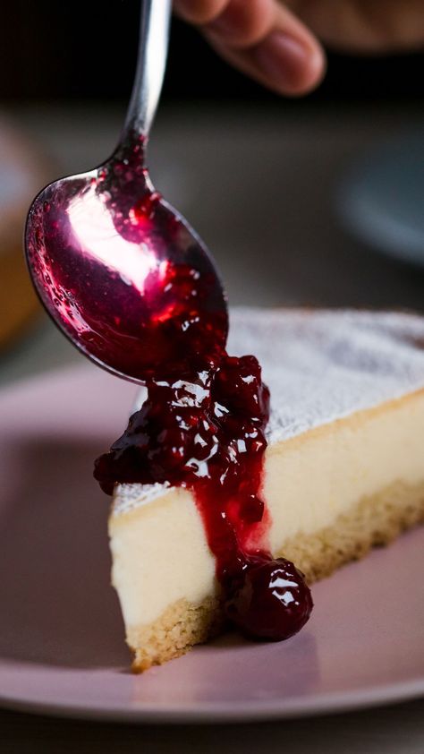 Image of a slice of cheesecake on a pink place with a spoonful of berry jam being poured on top. The Best Cheesecake Recipe, Flavored Cheesecake, Amazing Cheesecake, Cheesecake Flavors, Best Cheesecake Recipe, Cheesecake Ideas, American Cheesecake, Desserts Party, Cannabutter Recipe