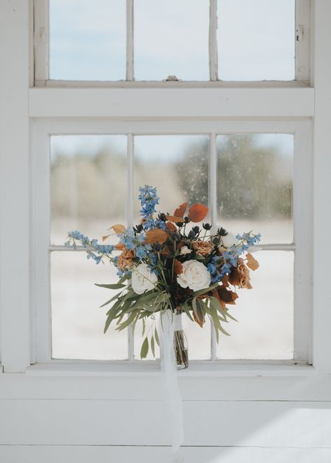 Pops of blue in the fall…yes please!!! When Julep Events reached out about renting our Farm Tables & tabletop beauties for their client’s wedding at Davis & Grey Farms in Celeste, TX, we were secretly praying behind-the-scenes they would say yes to our rentals! And they did!!! Julian & Anastasia’s wedding day was nothing short of stunning! Powder Blue Fall Wedding, Dusty Blue And Burnt Orange Wedding Bridal Bouquets, Fall Flowers With Blue, Fall Blue Bouquet, Blue Fall Wedding Bouquets, Dusty Blue Autumn Wedding, Blue Green Fall Wedding, Dusty Blue And Amber Wedding, Cornflower Blue Fall Wedding