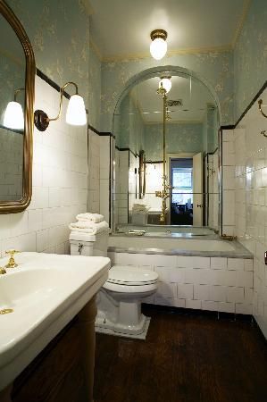 Mirror bath/shower stall tiles at Lafayette House, New York City Mirrored Walls, Tub Ideas, Retro Bathrooms, White Subway Tiles, Water Closet, Chandelier Decor, Black And White Tiles, Bathroom Tile Designs, Contemporary Bathrooms