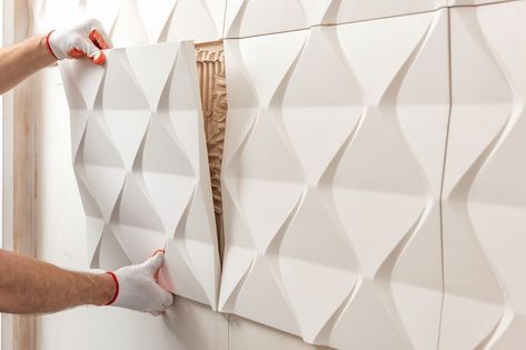 Installation of gypsum 3D panel. A worker is attaching the gypsum tile to the wall. Painted Interior Doors, Affordable Tile, Gypsum Wall, Galway City, Japanese Home Decor, 3d Panels, Brown Furniture, Travertine Tile, Kitchen Cabinet Colors