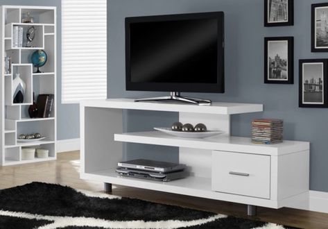 A sleek television stand that'll add a super modern, contemporary touch to your space and *also* serve as a display for your favorite little odds and ends. Simple Tv Stand, Wall Mount Entertainment Center, White Tv Cabinet, 60 Tv Stand, Simple Tv, White Tv Stands, Living Room Tv Unit Designs, Television Stands, White Tv