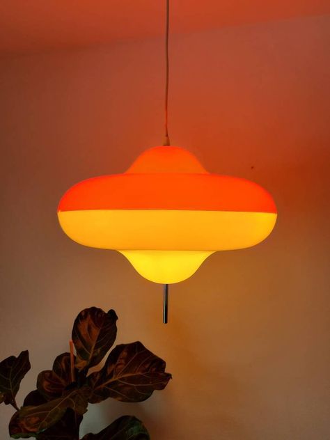 "This huge and extremly rare pendant lamp model Disco was designed by Cesare Maria Casati and Carlo Emanuele Ponzio in 1966 for Harvey Guzzini, Italy and produced by Meblo, Yugoslavia in early 70's. The lampshade of this amazing ceiling light is made of plastic in orange and white with a pole going through the middle and keeping the two parts together. This space age lamp is really an eye catcher. Very collectable for Meblo Guzzini lovers! 🧡 PLEASE READ THE CONDITION PART. CONDITION: This awsom Disco Light Fixture, Meblo Guzzini Lamp, Vintage Ceiling Lamp, 70s Lighting Fixtures, 70s Lamps, Champagne Poetry, Space Age Decor, Disco Lamp, Space Age Interior