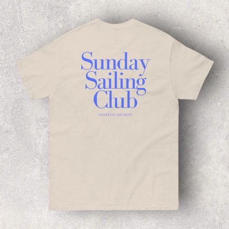 Elevate your casual wardrobe with our Sunday Sailing Club Vintage Blue T-Shirt. This shirt is more than just a piece of clothing; it's an expression of your love for sailing and the laid-back Sunday vibes. The "Sunday Sailing Club" graphic on the shirt adds a touch of retro charm. Made from soft and breathable fabric, it's perfect for warm days or layering under your favorite jacket. Whether you're a seasoned sailor or a landlubber dreaming of the sea, this shirt is a must-have for relaxed, week Sailing Shirt Design, Fest Ideas, Maritime Style, Sailor Theme, Lover Fashion, Sunday Vibes, Sea Lover, Coastal Chic, Sporty And Rich