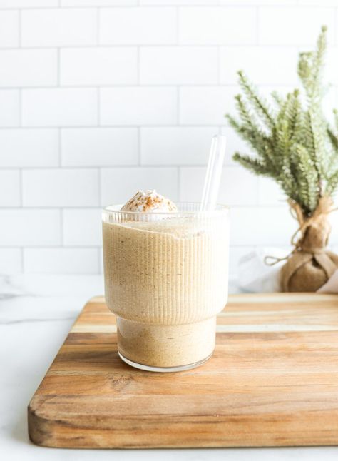 A vegan eggnog recipe transformed into a protein smoothie. This incredibly rich and creamy Eggnog Smoothie recipe tastes like the real deal, but is blended in minutes using wholesome plant-based ingredients. Created with frozen banana, medjool dates, vanilla plant protein, raw cashews, coconut milk, and holiday spices. It’s full of festive flavors, while being packed with nutrients, making it the perfect Christmas smoothie. Eggnog Smoothie, Christmas Smoothie, Vegan Eggnog Recipe, Holiday Smoothies, Vegan Beverages, Christmas Smoothies, Vegan Eggnog, Creamy Eggnog, Healthy Christmas Recipes