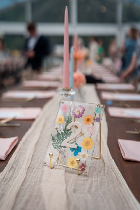 Creative Wedding Table Decorations, Garden Themed Wedding Reception, Summer Wedding Table Numbers, Colourful Garden Wedding, Midsummer Wedding Theme, Candle And Flower Centerpieces Wedding, Dried Flower Centerpiece Wedding, Pressed Flower Table Numbers, Wildflower Wedding Centerpiece