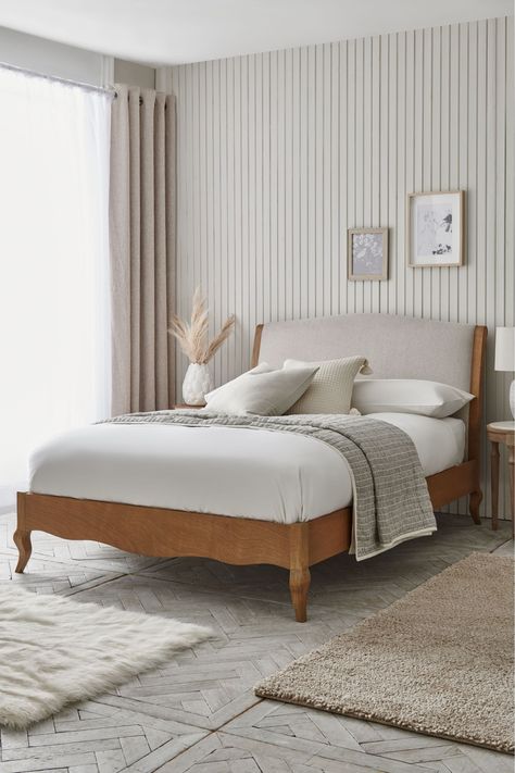 Our Josie bed's carved wooden shape is made from solid washed pine in a wood and light natural finish and is great as a stand alone statement or to sit back with the rest of our Josie range. Its plushy scrolls add to its french feel, making it perfectly suited to country homes. It is available in soft fabric or contemporary cane, combining structure and comfort. A sprung slatted base provides firmer support and allows air to circulate beneath the mattress. Wooden Upholstered Bed, Bed Back Rest Design, Wooden Bed Frame Design, Contemporary Wooden Bed, Wood King Bed Frame, Scandi Bed, French Furniture Bedroom, Wooden Bedroom, Oak Bedroom