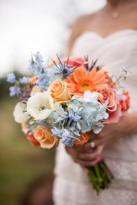 Light Blue And Peach Wedding Flowers, Pink Orange Blue Wedding Theme, Peach Pink Blue Wedding, Pink Orange Yellow Blue Wedding, Coral And Blue Wedding Colors, Baby Blue And Orange Wedding, July Wedding Flowers In Season, Peach And Blue Wedding Flowers, Wedding Flower Arrangements Summer