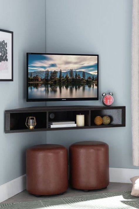 20 Floating Shelves Ideas, So You Can Create Extra Storage Space That Isn’t an Eyesore #purewow #organizing #home #decor #home picks Floating Corner Tv Stand, Corner Tv Ideas, Corner Tv Console, Deco Tv, Wall Mounted Media Console, Corner Tv Cabinets, Corner Tv Stands, Ruang Tv, Corner Tv Unit