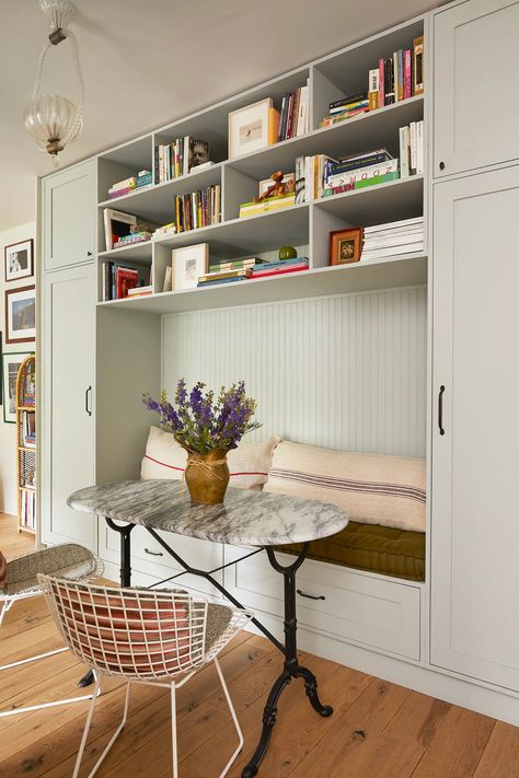 This 650-Square-Foot Studio Has the Most Perfect Small-Space Dining Nook | Architectural Digest Book Storage Ideas, Paris Living Rooms, Best Online Furniture Stores, Ceiling Shelves, Marble Tile Floor, London Apartment, Kitchen Nook, Book Storage, Dining Nook