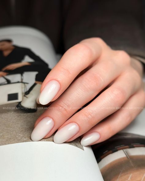 Wedding manicure 💍 milky white almond nails @tienda.ro nail products: ▫️Milky White Gel ▫️Ultra Finish Top Gelaxyo —Neglur Architech, Certified Nail Technician, Reykjavik #neglur #gelneglur #neglurinsta #weddingnails #reykjavik Milky White Oval Acrylic Nails, Oval Nails Milky White, Milky White Wedding Nails, Rounded Milky White Nails, Milky Manicure, Short Oval Milky White Nails, Almond Nails Milky White, Milky Almond Nails, Almond Nail Milky White