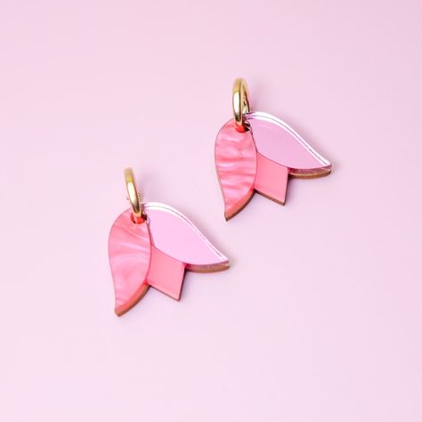 These Tulip charms add a lovely monochrome pop of color and are small and cute enough for when you want to be a little subtle. Hand-crafted from a combo of marbled, mirrored and frosted acrylic, paired with hand-stained wood. The charms hang from elegant 14k gold-filled hoops and are removable so you can wear the hoops on their own—two earrings in one! For this design we recommend the 15mm size (as shown in the photo) though the beauty is in being able to switch them up to match your mood and vi Nature, Tulip Earrings, Two Earrings, Blue Charm, Hoop Charms, Frosted Acrylic, Purple Tulips, Gold Filled Hoops, Pearl Collection