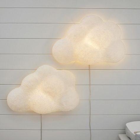 Set their room aglow with this gently illuminated cloud. Crafted of hand-finished paper-mache, it boasts billows of texture and dimension for a dreamy accent in your child's room.