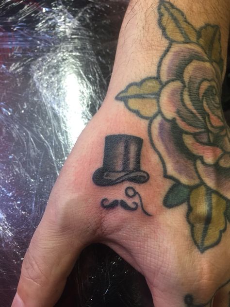 Top hat monocle moustache tattoo hand #paintingwithneedles Top Hat Tattoo Design, Tophat Tattoo, Monocle Tattoo, Moustache Tattoo, Top Hat Tattoo, Mustache Tattoo, Gentleman Tattoo, Doctor Tattoo, Learn To Tattoo