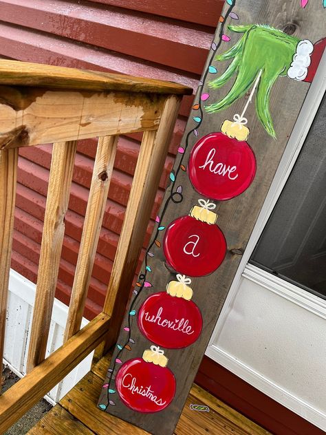 Easy & Affordable Dollar Store Christmas Crafts for a Festive Home Seasonal Wood Decor, Front Porch Signs Wooden Diy Christmas, Winter Porch Boards, Grinch Porch Leaner, Porch Leaner Sign Diy, Noel Christmas Sign, Whoville Christmas, Dollar Store Christmas Crafts, Grinch Christmas Decorations