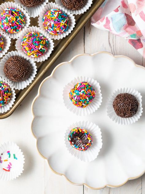 Brigadeiro Recipe - Decadent Brazilian Truffles are easy to make with cocoa powder, sweetened condensed milk, and butter. They're a deliciously rich dessert bursting with chocolate and caramel flavor, and covered in colorful sprinkles! #brigadeiro #brigadeiros #braziliantruffles #brazilianbrigadeiro #brigadeirorecipe #aspicyperspective Brazilian Truffles, Brazilian Brigadeiro, Condensed Milk Recipes Desserts, Brigadeiro Recipe, Milk Recipes Dessert, Chocolate And Caramel, A Spicy Perspective, Truffles Recipe, Condensed Milk Recipes